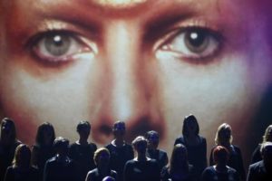 A choir performs to commemorate avant-garde musician David Bowie during the 2016 Echo Music Awards in Berlin, Thursday, April 7, 2016. (Clemens Bilan/dpa via AP)